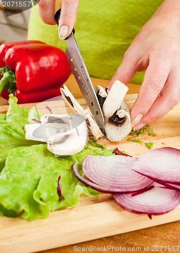 Image of cutting mushroom champignon