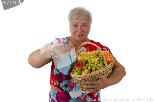 Image of Female senior holding fruit basket