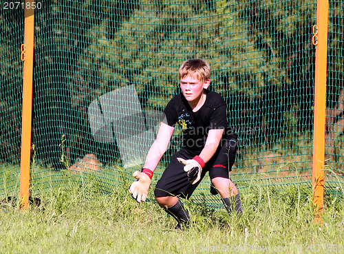 Image of Teenage Boy Soccer Goalie Practicing