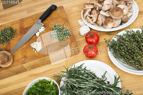Image of Vegetables With Chopping Board And Knife On Counter