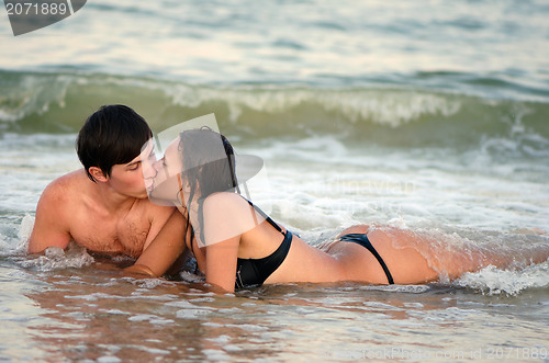Image of Young couple kissing