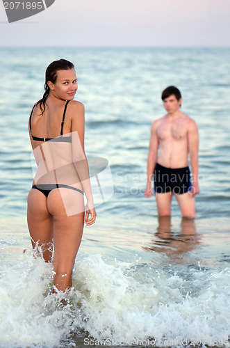 Image of Young couple in the sea