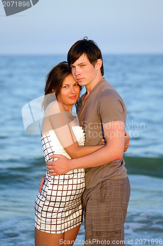 Image of happy young couple on the beach