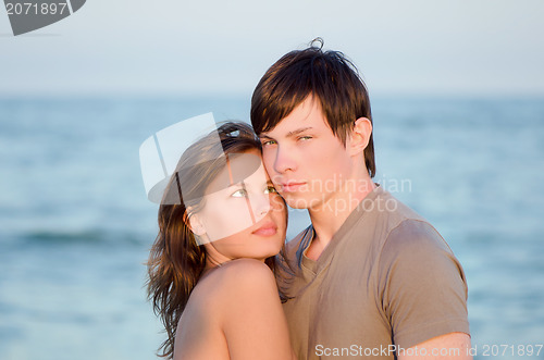 Image of sensual young couple on the beach