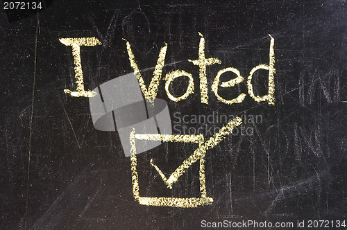 Image of Vote written on blackboard 