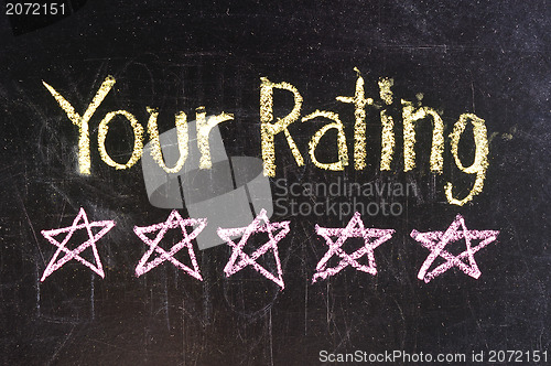 Image of Five stars ratings web yellow written on blackboard background 