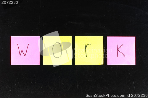 Image of paper WORK on blackboard