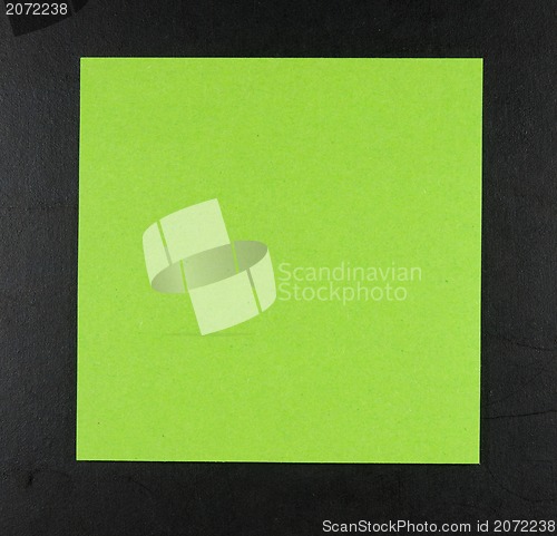 Image of Green postit on a blackboard