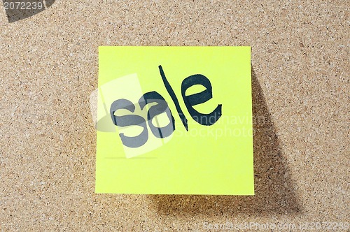Image of The word SALE Note paper with push pins on noticeboard 