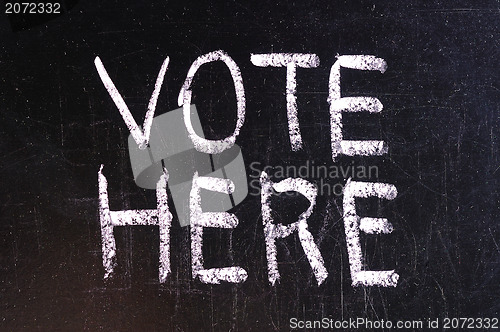Image of Vote written on blackboard 