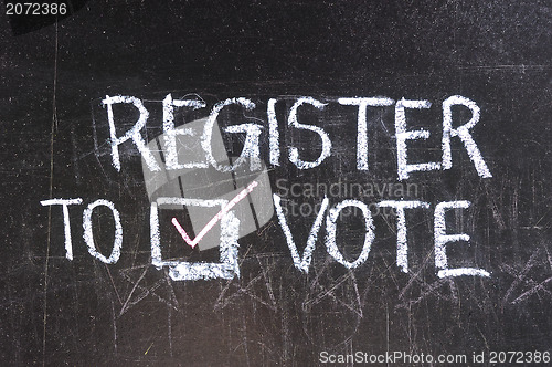 Image of Vote written on blackboard 