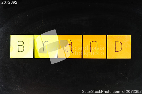 Image of Concept of brand paper on blackboard