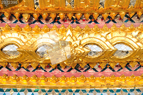 Image of The gold stucco design of native thai style on the Wall 
