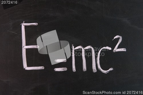 Image of Formula e=mc2. Theory of relativity written on school chalkboard