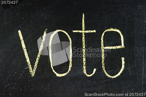 Image of Vote written on blackboard 