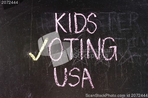 Image of Vote written on blackboard 