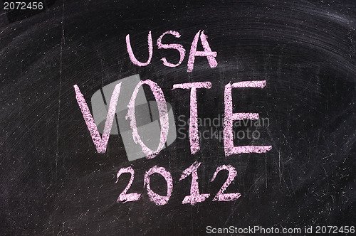 Image of Vote written on blackboard 