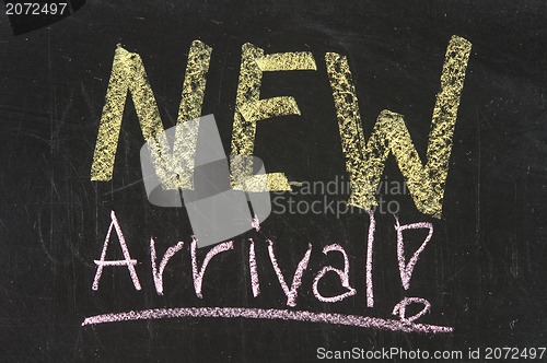 Image of New arrival words written on the chalkboard 