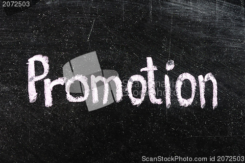 Image of Promotion handwritten with white chalk on a blackboard