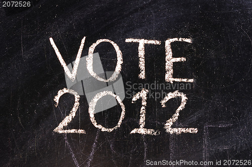 Image of Vote written on blackboard 