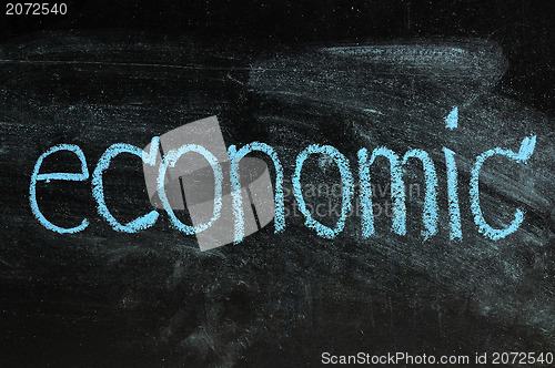 Image of business ECONOMIC written on blackboard 