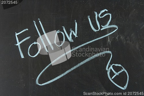 Image of Follow us and mouse drawn on the chalkboard 