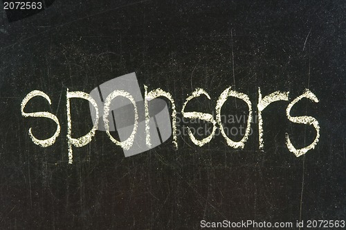 Image of The word SPONSORS handwritten with chalk  on a blackboard 