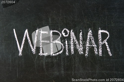 Image of The word Webinar handwritten with white chalk on a blackboard 