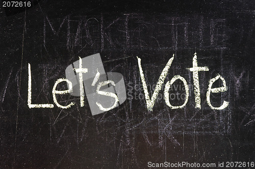 Image of Vote written on blackboard 