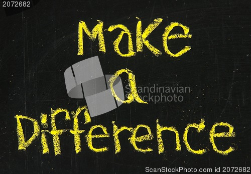 Image of make a difference phrase on blackboard