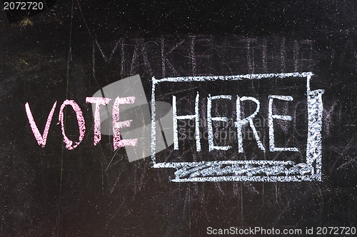 Image of Vote written on blackboard 