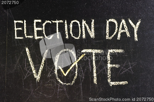 Image of Vote written on blackboard 