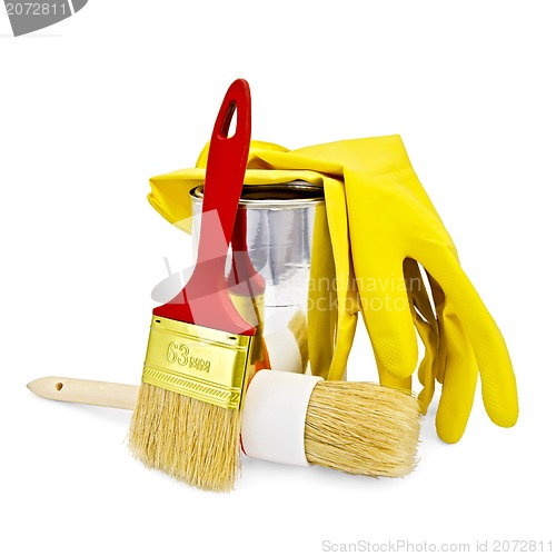 Image of Brushes with yellow gloves and a jar