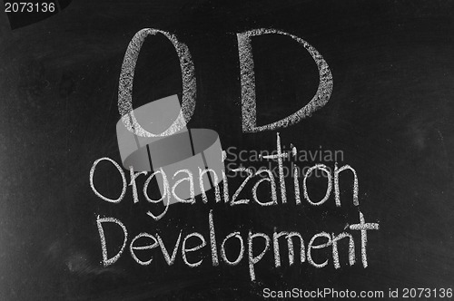 Image of OD concept written on blackboard background high resolution 