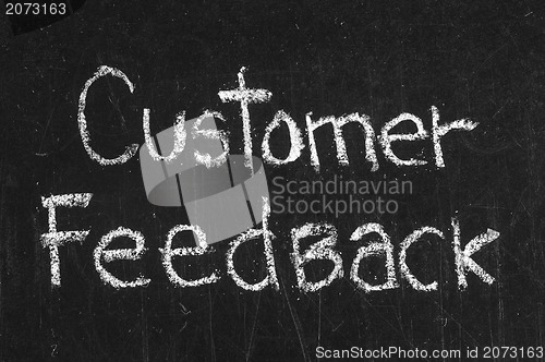 Image of Chalk drawing -CUSTOMER FEEDBACK word written on chalkboard 