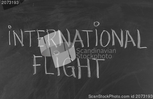 Image of Chalk drawing - INTERNATIONAL FLIGHT word written on chalkboard 