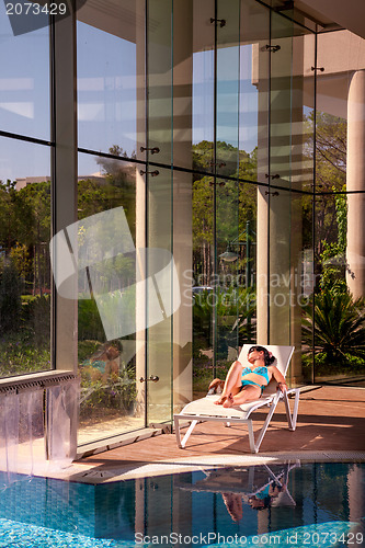 Image of girl on a sun lounger