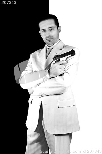 Image of Mafia with arms crossed and a gunon hand