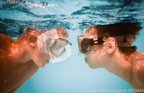 Image of Teenagers under water