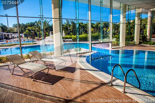 Image of Sunbeds in the indoor swimming pool
