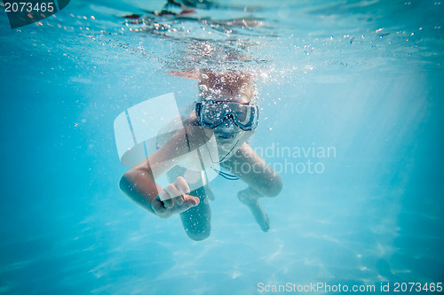 Image of Boy swimming under water