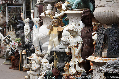 Image of Garden figurines at the flea market. Paris, France.