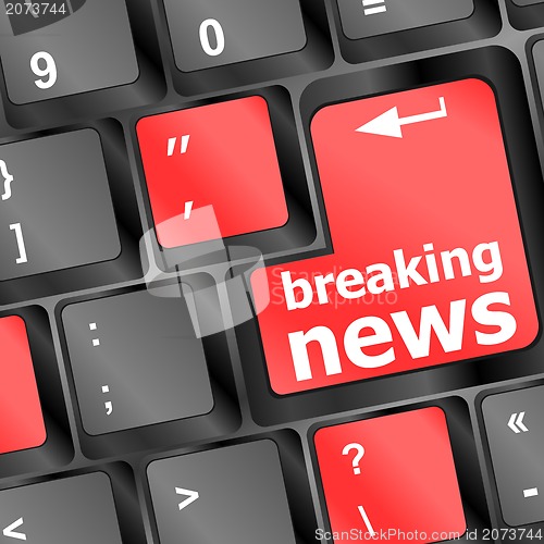 Image of Button with breaking news text and letter symbols on the keyboard