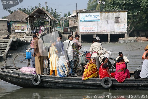 Image of Wooden boat crosses the Ganges River