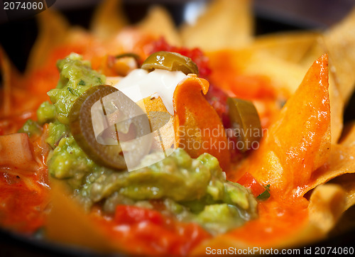 Image of Nachos with salsa verde and olives