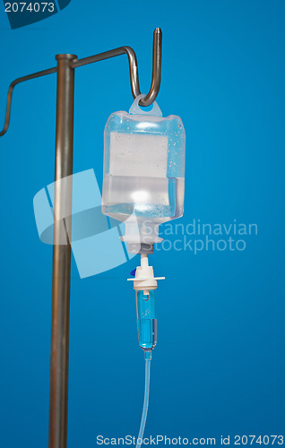 Image of Medicine dropper With an antibiotic on blue