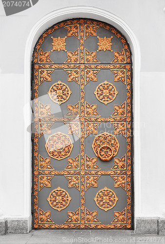 Image of Antique door with gold ornaments