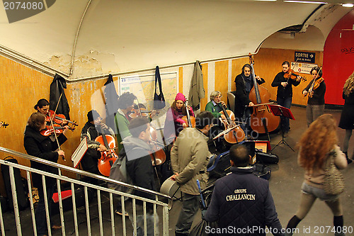 Image of Orchestra plays on the metro station in Paris