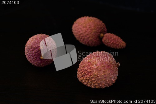 Image of Exotic lychee fruit on dark background