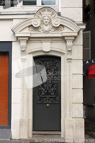 Image of Old Black Metal Door in Paris, France